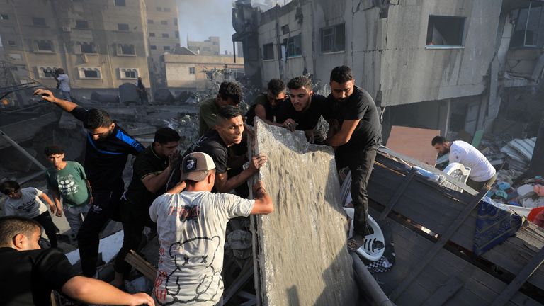 Rescuers search for survivors in the rubble of al Taj building. Pic: Reuters