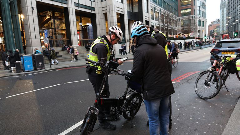 Officers stop an e-bike rider