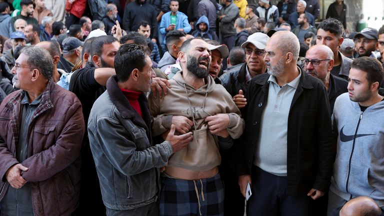 People mourn at a hospital in Nuseirat. Pic: Reuters