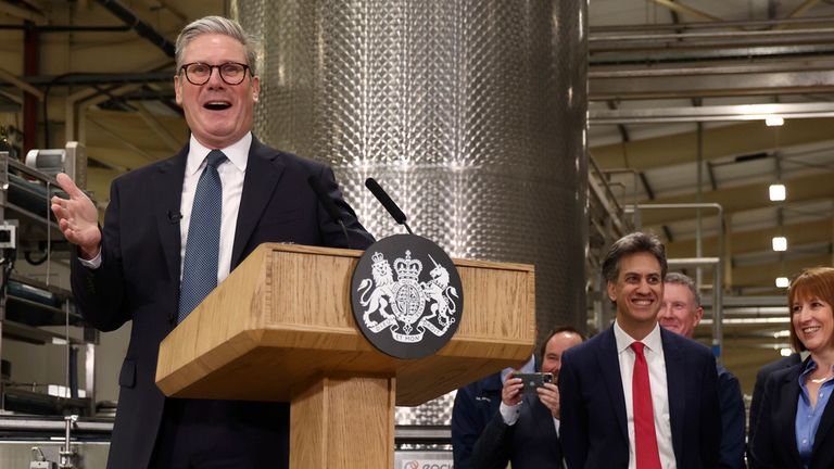 Britain's Prime Minister Keir Starmer, left, speaks as Chancellor of the Exchequer Rachel Reeves, right, and Secretary of State for Energy Security and Net Zero Ed Miliband listen at a factory in Chester, England, Friday, Oct. 4, 2024.(AP Photo/Darren Staples, Pool)