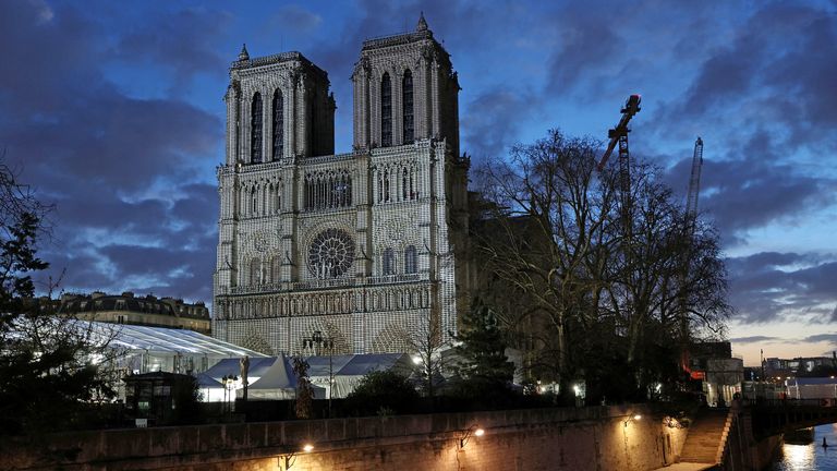 View of a light show rehearsal on the facade of the Notre-Dame de Paris Cathedral, which was ravaged by a fire in 2019, before the reopening ceremonies in Paris, France, December 6, 2024. REUTERS/Kevin Coombs 