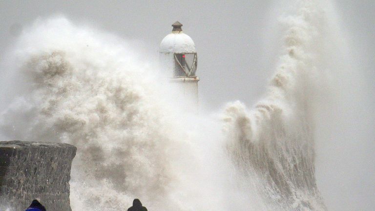 Waves crash over the seafront in Porthcawl in Wales. Millions have been warned to stay indoors, thousands are without power and trains have been cancelled as the Government's "risk to life" alert brought on by Storm Darragh came into force. Picture date: Saturday December 7, 2024. PA Photo. Photo credit should read: Ben Birchall/PA Wire 